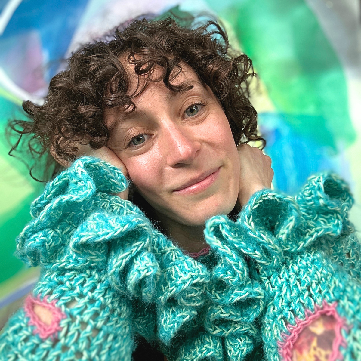 Danielle, founder of HODY, smiling in a colorful crocheted top
